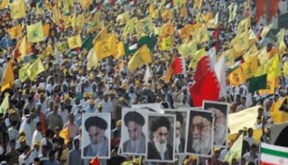 Demonstrators waving Hezbollah flags and holding pictures of Khomeini